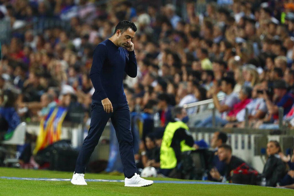 Barcelona players react after Bayern's Benjamin Pavard scores his side's third goal during the Champions League Group C soccer match between Barcelona and Bayern Munich at the Camp Nou stadium in Barcelona, Spain, Wednesday, Oct. 26, 2022. (AP Photo/Joan Monfort)