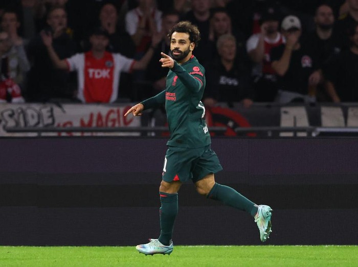 AMSTERDAM, NETHERLANDS - OCTOBER 26: Mohamed Salah of Liverpool celebrates after scoring a goal to make it 0-1 during the UEFA Champions League group A match between AFC Ajax and Liverpool FC at Johan Cruyff Arena on October 26, 2022 in Amsterdam, Netherlands. (Photo by Matthew Ashton - AMA/Getty Images)