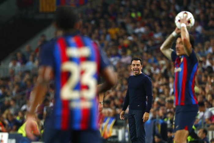 Xavi Hernandez Barcelona's head coach Xavi Hernandez, centre, gives instructions from the side line during the Champions League Group C soccer match between Barcelona and Bayern Munich at the Camp Nou stadium in Barcelona, Spain, Wednesday, Oct. 26, 2022. (AP Photo/Joan Monfort)