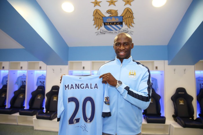 Eliaquim Mangala Barclays Premier League, Manchester City, Eliaquim Mangala signing, Etihad Stadium, Eliaquim Mangala holding up his shirt in the dressing room (Photo by Victoria Haydn/Manchester City FC via Getty Images)