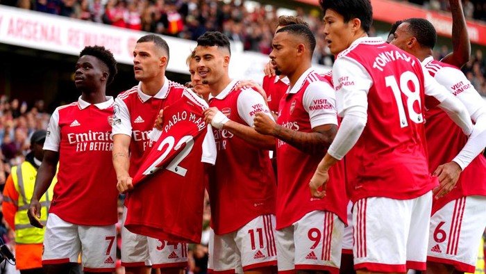 Arsenals Gabriel Martinelli (centre) holds up former team-mate Pablo Maris shirt as he celebrates scoring their sides first goal of the game during the Premier League match at the Emirates Stadium, London. Picture date: Sunday October 30, 2022. (Photo by John Walton/PA Images via Getty Images)