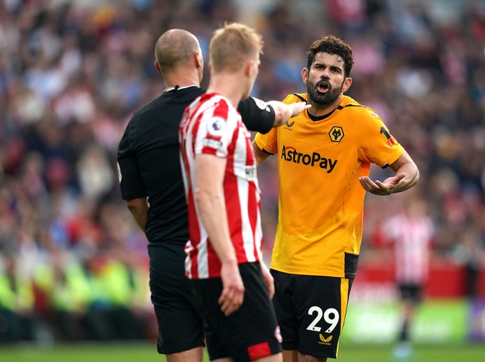 Diego Costa Vs Brentford Wolverhampton Wanderers' Diego Costa (right) speaks to referee Robert Madley before a VAR check and resulting red card for a foul on Brentford's Ben Mee during the Premier League match at the Gtech Community Stadium, London. Picture date: Saturday October 29, 2022. (Photo by John Walton/PA Images via Getty Images)