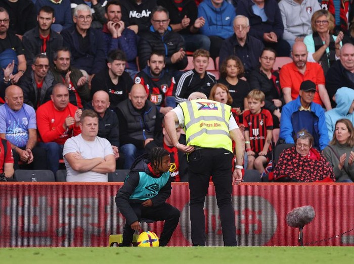 BOURNEMOUTH, ENGLAND - OCTOBER 29: A ball boy leaves the field and is escorted by a steward during the Premier League match between AFC Bournemouth and Tottenham Hotspur at Vitality Stadium on October 29, 2022 in Bournemouth, England. (Photo by Ryan Pierse/Getty Images)