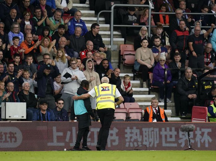 A ball boy is lead off the pitch by a steward during the Premier League match at the Vitality Stadium, Bournemouth. Picture date: Saturday October 29, 2022. (Photo by Andrew Matthews/PA Images via Getty Images)