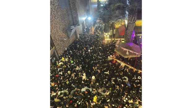 A street in Itaewon district is pictured full of people before a stampede during Halloween festivities killed and injured many in Seoul, South Korea, in this image released by Yonhap on October 30, 2022. Yonhap via REUTERS ATTENTION EDITORS - THIS IMAGE HAS BEEN SUPPLIED BY A THIRD PARTY. SOUTH KOREA OUT. NO RESALES. NO ARCHIVES. THE IMAGE HAS BEEN PIXELATED AT SOURCE.