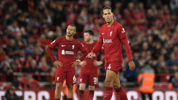 Liverpools Dutch defender Virgil van Dijk (R) looks on after Leeds Uniteds Dutch striker Crysencio Summerville (not seen) scores his teams second goal during the English Premier League football match between Liverpool and Leeds United at Anfield in Liverpool, north west England on October 29, 2022. - - RESTRICTED TO EDITORIAL USE. No use with unauthorized audio, video, data, fixture lists, club/league logos or live services. Online in-match use limited to 120 images. An additional 40 images may be used in extra time. No video emulation. Social media in-match use limited to 120 images. An additional 40 images may be used in extra time. No use in betting publications, games or single club/league/player publications. (Photo by Oli SCARFF / AFP) / RESTRICTED TO EDITORIAL USE. No use with unauthorized audio, video, data, fixture lists, club/league logos or live services. Online in-match use limited to 120 images. An additional 40 images may be used in extra time. No video emulation. Social media in-match use limited to 120 images. An additional 40 images may be used in extra time. No use in betting publications, games or single club/league/player publications. / RESTRICTED TO EDITORIAL USE. No use with unauthorized audio, video, data, fixture lists, club/league logos or live services. Online in-match use limited to 120 images. An additional 40 images may be used in extra time. No video emulation. Social media in-match use limited to 120 images. An additional 40 images may be used in extra time. No use in betting publications, games or single club/league/player publications. (Photo by OLI SCARFF/AFP via Getty Images)