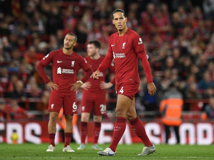 Liverpool's Dutch defender Virgil van Dijk (R) looks on after Leeds United's Dutch striker Crysencio Summerville (not seen) scores his team's second goal during the English Premier League football match between Liverpool and Leeds United at Anfield in Liverpool, north west England on October 29, 2022. - - RESTRICTED TO EDITORIAL USE. No use with unauthorized audio, video, data, fixture lists, club/league logos or 'live' services. Online in-match use limited to 120 images. An additional 40 images may be used in extra time. No video emulation. Social media in-match use limited to 120 images. An additional 40 images may be used in extra time. No use in betting publications, games or single club/league/player publications. (Photo by Oli SCARFF / AFP) / RESTRICTED TO EDITORIAL USE. No use with unauthorized audio, video, data, fixture lists, club/league logos or 'live' services. Online in-match use limited to 120 images. An additional 40 images may be used in extra time. No video emulation. Social media in-match use limited to 120 images. An additional 40 images may be used in extra time. No use in betting publications, games or single club/league/player publications. / RESTRICTED TO EDITORIAL USE. No use with unauthorized audio, video, data, fixture lists, club/league logos or 'live' services. Online in-match use limited to 120 images. An additional 40 images may be used in extra time. No video emulation. Social media in-match use limited to 120 images. An additional 40 images may be used in extra time. No use in betting publications, games or single club/league/player publications. (Photo by OLI SCARFF/AFP via Getty Images)