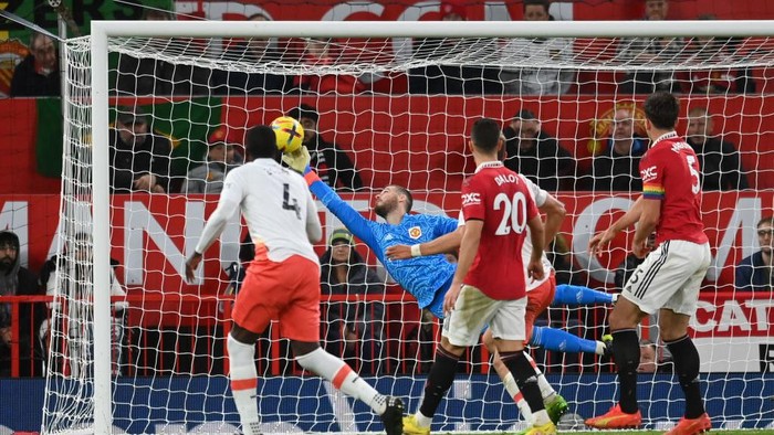 MANCHESTER, ENGLAND - OCTOBER 30: David De Gea of Manchester United makes a save from Kurt Zouma of West Ham United during the Premier League match between Manchester United and West Ham United at Old Trafford on October 30, 2022 in Manchester, England. (Photo by Michael Regan/Getty Images)