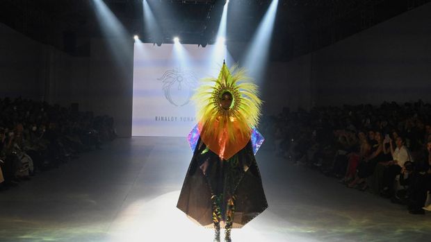 A model presents a creation by Rinaldy Yunardi during the 2022 Jakarta Fashion Week in Jakarta on October 30, 2022. (Photo by ADEK BERRY / AFP)