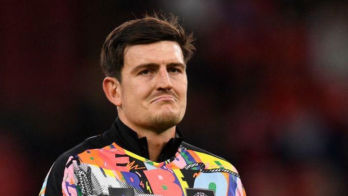 Manchester Uniteds English defender Harry Maguire warms up ahead of the English Premier League football match between Manchester United and West Ham United at Old Trafford in Manchester, north-west England, on October 30, 2022. - RESTRICTED TO EDITORIAL USE. No use with unauthorized audio, video, data, fixture lists, club/league logos or live services. Online in-match use limited to 120 images. An additional 40 images may be used in extra time. No video emulation. Social media in-match use limited to 120 images. An additional 40 images may be used in extra time. No use in betting publications, games or single club/league/player publications. (Photo by Oli SCARFF / AFP) / RESTRICTED TO EDITORIAL USE. No use with unauthorized audio, video, data, fixture lists, club/league logos or live services. Online in-match use limited to 120 images. An additional 40 images may be used in extra time. No video emulation. Social media in-match use limited to 120 images. An additional 40 images may be used in extra time. No use in betting publications, games or single club/league/player publications. / RESTRICTED TO EDITORIAL USE. No use with unauthorized audio, video, data, fixture lists, club/league logos or live services. Online in-match use limited to 120 images. An additional 40 images may be used in extra time. No video emulation. Social media in-match use limited to 120 images. An additional 40 images may be used in extra time. No use in betting publications, games or single club/league/player publications. (Photo by OLI SCARFF/AFP via Getty Images)