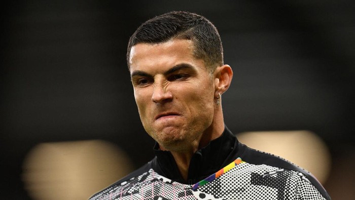 Manchester Uniteds Portuguese striker Cristiano Ronaldo gestures as he warm up ahead of the English Premier League football match between Manchester United and West Ham United at Old Trafford in Manchester, north-west England, on October 30, 2022. - RESTRICTED TO EDITORIAL USE. No use with unauthorized audio, video, data, fixture lists, club/league logos or live services. Online in-match use limited to 120 images. An additional 40 images may be used in extra time. No video emulation. Social media in-match use limited to 120 images. An additional 40 images may be used in extra time. No use in betting publications, games or single club/league/player publications. (Photo by Oli SCARFF / AFP) / RESTRICTED TO EDITORIAL USE. No use with unauthorized audio, video, data, fixture lists, club/league logos or live services. Online in-match use limited to 120 images. An additional 40 images may be used in extra time. No video emulation. Social media in-match use limited to 120 images. An additional 40 images may be used in extra time. No use in betting publications, games or single club/league/player publications. / RESTRICTED TO EDITORIAL USE. No use with unauthorized audio, video, data, fixture lists, club/league logos or live services. Online in-match use limited to 120 images. An additional 40 images may be used in extra time. No video emulation. Social media in-match use limited to 120 images. An additional 40 images may be used in extra time. No use in betting publications, games or single club/league/player publications. (Photo by OLI SCARFF/AFP via Getty Images)