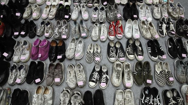 TOPSHOT - Items retrieved by police from the scene of a fatal Halloween crowd surge that killed more than 150 people in the Itaewon district are displayed at a gymnasium for relatives of victims to collect, in Seoul on November 1, 2022. - At least 156 mostly young people were killed, and scores more injured, in a deadly crowd surge late October 29 at the first post-pandemic Halloween party in Seoul's popular Itaewon nightlife district. (Photo by Anthony WALLACE / AFP) (Photo by ANTHONY WALLACE/AFP via Getty Images)