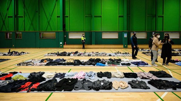 TOPSHOT - Items retrieved by police from the scene of a fatal Halloween crowd surge that killed more than 150 people in the Itaewon district are displayed at a gymnasium for relatives of victims to collect, in Seoul on November 1, 2022. - At least 156 mostly young people were killed, and scores more injured, in a deadly crowd surge late October 29 at the first post-pandemic Halloween party in Seoul's popular Itaewon nightlife district. (Photo by Anthony WALLACE / AFP) (Photo by ANTHONY WALLACE/AFP via Getty Images)