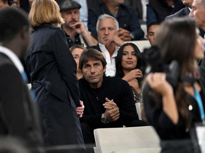 Tottenham's Italian head coach Antonio Conte (C) sits at the tribune to watch the UEFA Champions League group D football match between Olympique Marseille (OM) and Tottenham Hotspur at The Velodrome Stadium in Marseille, southern France on November 1, 2022. - Tottenham's Italian head coach Antonio Conte was shown a red card during the match with Sporting Lisbon on October 26, 2022 for his reaction after an injury time goal was disallowed. (Photo by Christophe SIMON / AFP) (Photo by CHRISTOPHE SIMON/AFP via Getty Images)