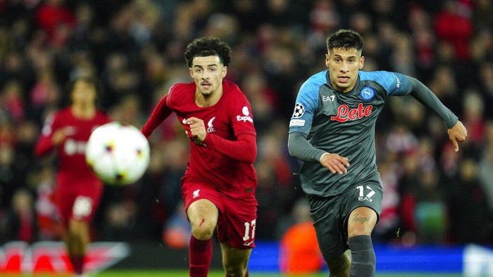 Liverpool's Darwin Nunez, left, and Liverpool's Mohamed Salah celebrate at the end of the Champions League Group A soccer match between Liverpool and Napoli, at Anfield stadium in Liverpool, England, Tuesday, Nov. 1, 2022. (AP Photo/Jon Super)