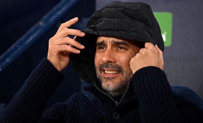 MANCHESTER, ENGLAND - NOVEMBER 02: Pep Guardiola, Manager of Manchester City looks on from the bench prior to the UEFA Champions League group G match between Manchester City and Sevilla FC at Etihad Stadium on November 02, 2022 in Manchester, England. (Photo by Stu Forster/Getty Images)