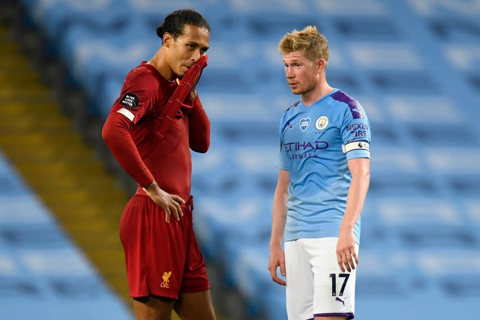 Liverpools Dutch defender Virgil van Dijk (L) and Manchester Citys Belgian midfielder Kevin De Bruyne (R) chat on the pitch after the English Premier League football match between Manchester City and Liverpool at the Etihad Stadium in Manchester, north west England, on July 2, 2020. - Manchester City won the game 4-0. (Photo by PETER POWELL / POOL / AFP) / RESTRICTED TO EDITORIAL USE. No use with unauthorized audio, video, data, fixture lists, club/league logos or live services. Online in-match use limited to 120 images. An additional 40 images may be used in extra time. No video emulation. Social media in-match use limited to 120 images. An additional 40 images may be used in extra time. No use in betting publications, games or single club/league/player publications. /  (Photo by PETER POWELL/POOL/AFP via Getty Images)