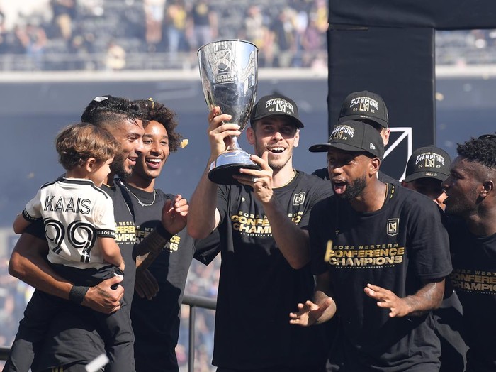 LOS ANGELES, CA - OCTOBER 30: Gareth Bale #11 of Los Angeles FC holds the championship trophy as he celebrates with teammates after defeating Austin FC, 3-0, during the Western Conference Finals of the 2022 MLS Cup Playoffs at Banc of California Stadium on October 30, 2022 in Los Angeles, California. (Photo by Kevork Djansezian/Getty Images)