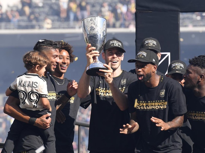 LOS ANGELES, CA - OCTOBER 30: Gareth Bale #11 of Los Angeles FC holds the championship trophy as he celebrates with teammates after defeating Austin FC, 3-0, during the Western Conference Finals of the 2022 MLS Cup Playoffs at Banc of California Stadium on October 30, 2022 in Los Angeles, California. (Photo by Kevork Djansezian/Getty Images)