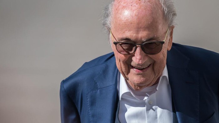 Former FIFA president Sepp Blatter reacts as he arrives to Switzerlands Federal Criminal Court to listen to the verdict of his trial over a suspected fraudulent payment, in the southern Switzerland city of Bellinzona, on July 8, 2022. - The Bellinzona court will hand down its verdict in the trial of former UEFA president Michel Platini and former FIFA president Sepp Blatter. Blatter and Platini are being tried over a two-million-Swiss-franc ($2 million) payment in 2011 to the former France captain, who by that time was in charge of European footballs governing body UEFA. (Photo by Fabrice COFFRINI / AFP) (Photo by FABRICE COFFRINI/AFP via Getty Images)