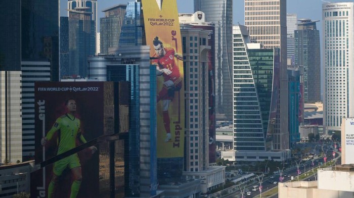 A banner depicting Wales captain Gareth Bale (C) hangs alongside a building in Doha on October 23, 2022, ahead of the Qatar 2022 FIFA World Cup football tournament. (Photo by Gabriel BOUYS / AFP) (Photo by GABRIEL BOUYS/AFP via Getty Images)