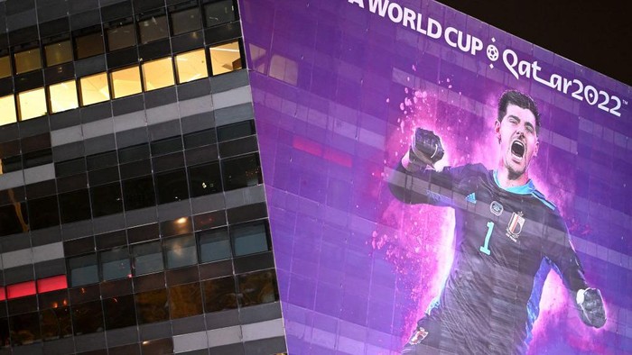 A banner depicting the Belgium goalkepper Thibault Courtois hangs alongside a building in Doha on October 30, 2022, ahead of the Qatar 2022 FIFA World Cup football tournament. (Photo by GABRIEL BOUYS / AFP) (Photo by GABRIEL BOUYS/AFP via Getty Images)