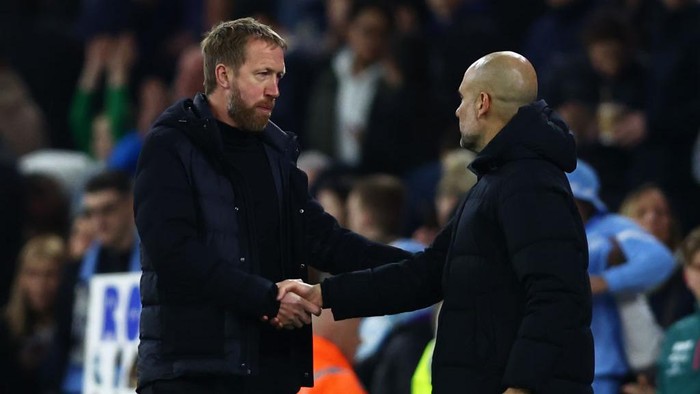 MANCHESTER, ENGLAND - APRIL 20: Graham Potter, Manager of Brighton & Hove Albion shakes hands with Pep Guardiola, Manager of Manchester City after the Premier League match between Manchester City and Brighton & Hove Albion at Etihad Stadium on April 20, 2022 in Manchester, England. (Photo by Clive Brunskill/Getty Images)