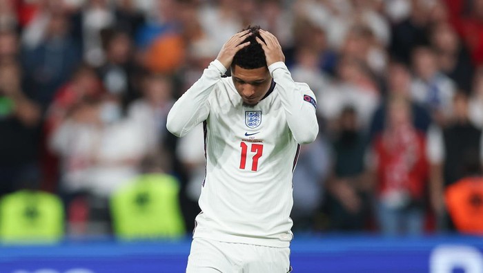 LONDON, ENGLAND - JULY 11: Jadon Sancho of England looks dejected after missing their teams fourth penalty as it is saved during a penalty shoot out during the UEFA Euro 2020 Championship Final between Italy and England at Wembley Stadium on July 11, 2021 in London, England. (Photo by Eddie Keogh - The FA/The FA via Getty Images)