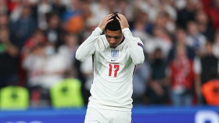 Jadon Sancho LONDON, ENGLAND - JULY 11: Jadon Sancho of England looks dejected after missing their team's fourth penalty as it is saved during a penalty shoot out during the UEFA Euro 2020 Championship Final between Italy and England at Wembley Stadium on July 11, 2021 in London, England. (Photo by Eddie Keogh - The FA/The FA via Getty Images)