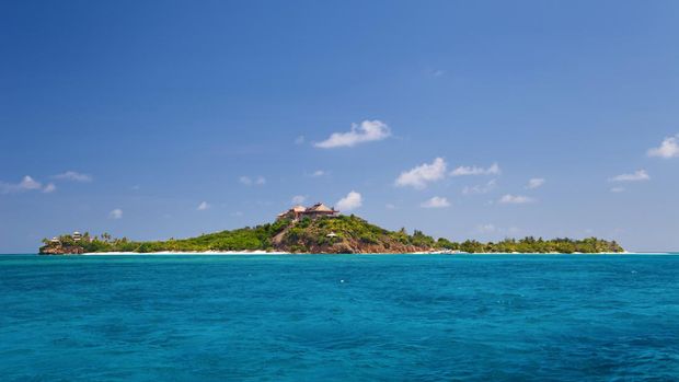 view of luxurious Necker Island, British Virgin Islands taken from a boat