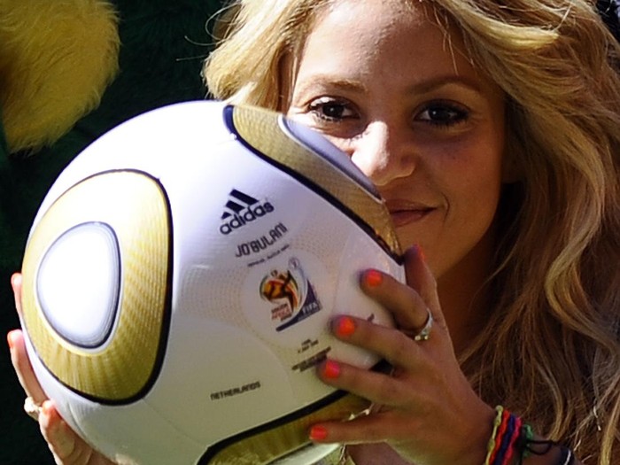 Colombian singer Shakira holds the Jo'bulani football that will be used for the final after a press conference on July 10, 2010 at Soccer City Stadium in Soweto, suburb of Johannesburg, on the eve of the 2010 Football World Cup final between The Netherlands and Spain. South Africa basked today in the success of its trouble-free World Cup, as finishing touches were put to the closing ceremony with superstar Shakira and a herd of giant elephant puppets. AFP PHOTO / STEPHANE DE SAKUTIN (Photo credit should read STEPHANE DE SAKUTIN/AFP via Getty Images)