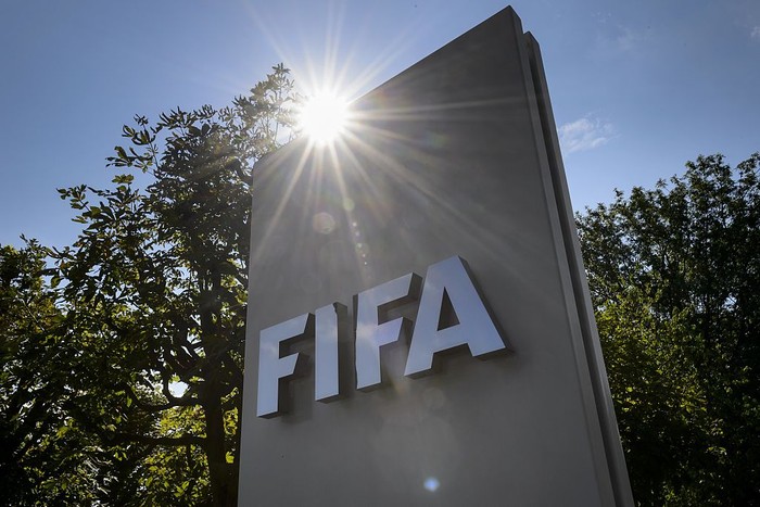 Logo FIFA A sign of the FIFA is seen at the entrance of the footballs world body on July 20, 2015 in Zurich. FIFA leaders met July 20 to decide a date for an election to replace president Sepp Blatter and reform steps as footballs world body confronts its biggest corruption crisis. AFP PHOTO / FABRICE COFFRINI (Photo credit should read FABRICE COFFRINI/AFP via Getty Images)