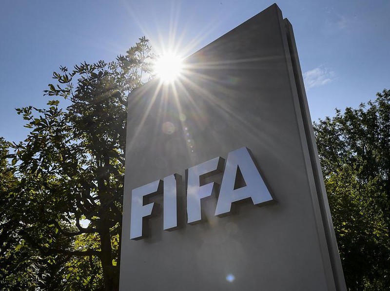 A sign of the FIFA is seen at the entrance of the football's world body on July 20, 2015 in Zurich. FIFA leaders met July 20 to decide a date for an election to replace president Sepp Blatter and reform steps as football's world body confronts its biggest corruption crisis.  AFP PHOTO / FABRICE COFFRINI        (Photo credit should read FABRICE COFFRINI/AFP via Getty Images)