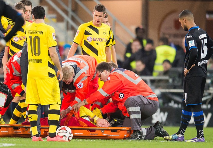 Marco Reus PADERBORN, GERMANY - NOVEMBER 22: Marco Reus of Dortmund gets injured during the Bundesliga match between SC Paderborn 07 and Borussia Dortmund at Benteler Arena on NOVEMBER 22, 2014 in Paderborn, Germany. (Photo by Alexandre Simoes/Borussia Dortmund via Getty Images)