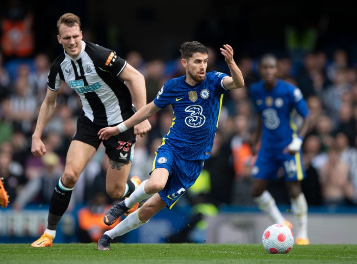 LONDON, ENGLAND - MARCH 13: Jorginho of Chelsea takes the ball away from Dan Burn of Newcastle United during the Premier League match between Chelsea and Newcastle United at Stamford Bridge on March 13, 2022 in London, England. (Photo by Visionhaus/Getty Images)