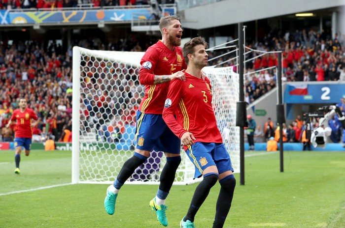 Sergio Ramos, Gerard Pique Spain's Gerard Pique celebrates scoring his side's first goal of the game with teammate Sergio Ramos (left)