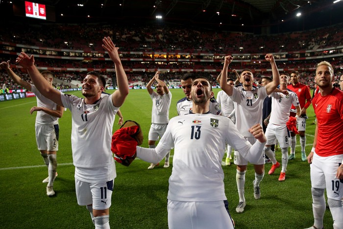 Serbia's team players celebrate the victory at the end the FIFA World Cup Qatar 2022  qualification group A football match between Portugal and Serbia at the Luz stadium in Lisbon, Portugal, on November 14, 2021. (Photo by Pedro Fiúza/NurPhoto via Getty Images)