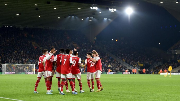 WOLVERHAMPTON, ENGLAND - NOVEMBER 12: Martin Oedegaard of Arsenal celebrates with teammates after scoring their teams first goal during the Premier League match between Wolverhampton Wanderers and Arsenal FC at Molineux on November 12, 2022 in Wolverhampton, England. (Photo by Harriet Lander/Getty Images)