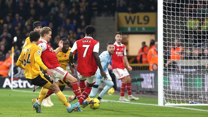 Arsenals Martin Odegaard (second left) scores their sides first goal of the game during the Premier League match at Molineux, Wolverhampton. Picture date: Saturday November 12, 2022. (Photo by Nigel French/PA Images via Getty Images)