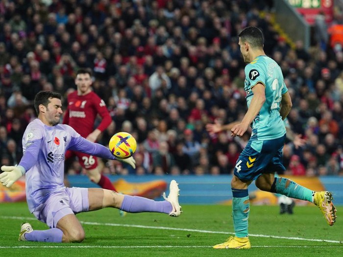 Southampton's Mohamed Elyounoussi (right) has a shot on goal saved by Liverpool goalkeeper Alisson Becker during the Premier League match at Anfield, Liverpool. Picture date: Saturday November 12, 2022. (Photo by Nick Potts/PA Images via Getty Images)