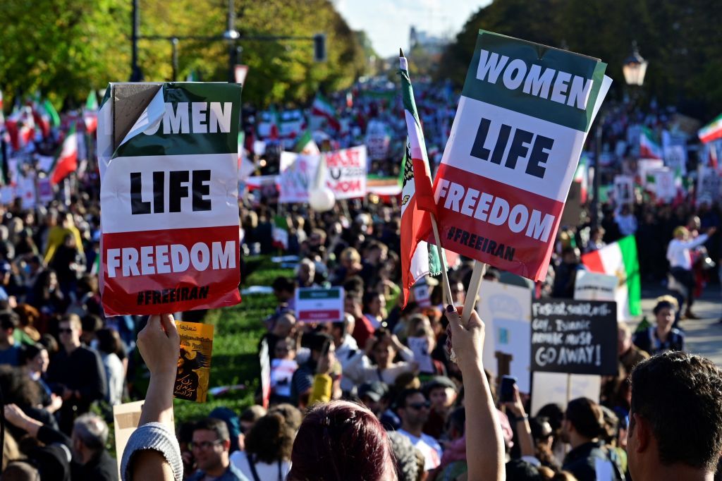 Protesters display placards with the lettering reading 'Women, Life, Freedom' in a rally in support of the demonstrations in Iran, in Berlin, Germany on October 22, 2022. - Nationwide protests have erupted in Iran after the death of Mahsa Amini, an Iranian woman of Kurdish origin, who was arrested by the country's notorious 