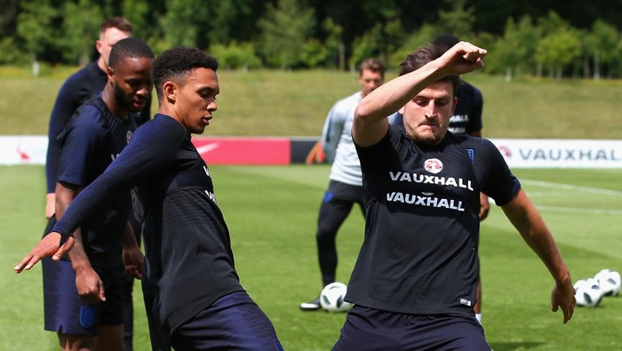 BURTON-UPON-TRENT, ENGLAND - JUNE 06:  Trent Alexander-Arnold battles for posession with Harry Maguire of England during the England training session at St Georges Park on June 6, 2018 in Burton-upon-Trent, England.  (Photo by Alex Livesey/Getty Images)
