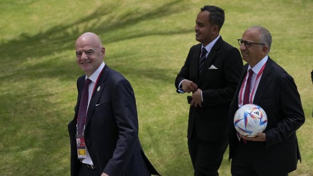 FIFA President Gianni Infantino, left, walks during the G20 Summit at the Nusa Dua, Bali, Indonesia on Tuesday, Nov. 15, 2022. (AP Photo/Achmad Ibrahim, Pool)