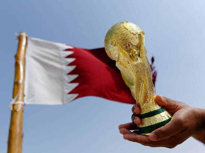 DOHA, QATAR - NOVEMBER 14: Images of Gareth Bale of Wales, Hassan Al-Haydos of Qatar and the FIFA World Cup trophy are seen on sky scrapers in the West Bay area ahead of the FIFA World Cup Qatar 2022 on November 14, 2022 in Doha, Qatar. (Photo by Catherine Ivill/Getty Images)