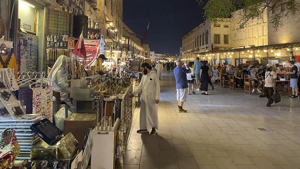 A picture shows tourists in Qatar's touristic Souq Waqif bazar in the capital Doha on September 4, 2022. (Photo by KARIM JAAFAR / AFP)