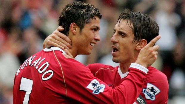 MANCHESTER, ENGLAND - OCTOBER 1: Cristiano Ronaldo of Manchester United celebrates Ole Gunnar Solskjaer scoring the first goal with team mate Gary Neville during the Barclays Premiership match between Manchester United and Newcastle United at Old Trafford on October 1 2006 in Manchester, England. (Photo by Matthew Peters/Manchester United via Getty Images)
