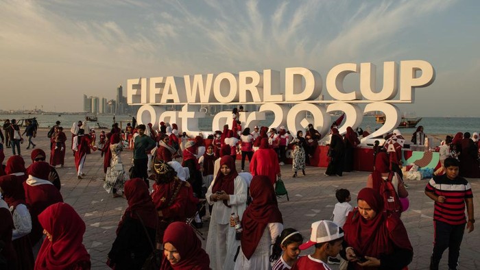 DOHA, QATAR - NOVEMBER 12: Members of the Ladies Mega Fans football supporters group gather at the Corniche next to the Fifa World Cup logo ahead of the FIFA World Cup Qatar 2022 on November 12, 2022 in Doha, Qatar. (Photo by David Ramos - FIFA/FIFA via Getty Images)