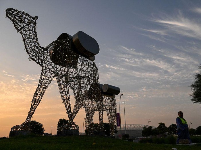 An installation showing camels is displayed outside the Ahmed bin Ali Stadium in Al-Rayyan on November 12, 2022, ahead of the Qatar 2022 FIFA World Cup football tournament. (Photo by Kirill KUDRYAVTSEV / AFP) (Photo by KIRILL KUDRYAVTSEV/AFP via Getty Images)