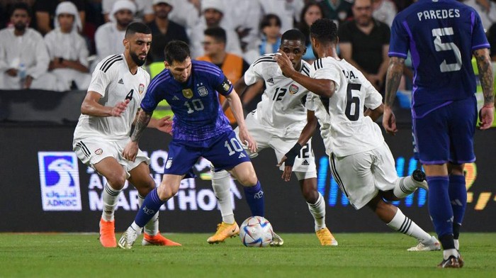 Argentinas forward Lionel Messi (2nd L) is marked by UAE players during the friendly football match between Argentina and the United Arab Emirates at the Mohammed Bin Zayed Stadium in Abu Dhabi, on November 16, 2022. (Photo by Ryan LIM / AFP) (Photo by RYAN LIM/AFP via Getty Images)