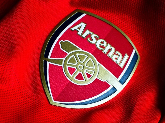 MADDALONI, CASERTA, ITALY - 2022/11/11: In this photo illustration a English Arsenal team logo sewn on a red jersey. Famous team of the British league founded by David Danskin, it is one of the strongest and most successful teams in football history. (Photo Illustration by Vincenzo Izzo/LightRocket via Getty Images)